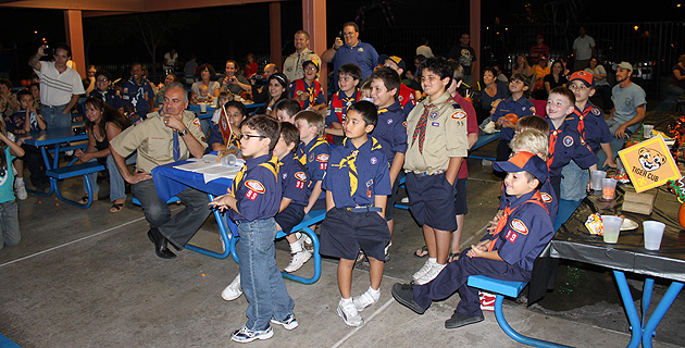 Pack 99 boys watch a skit performed by the Webelos